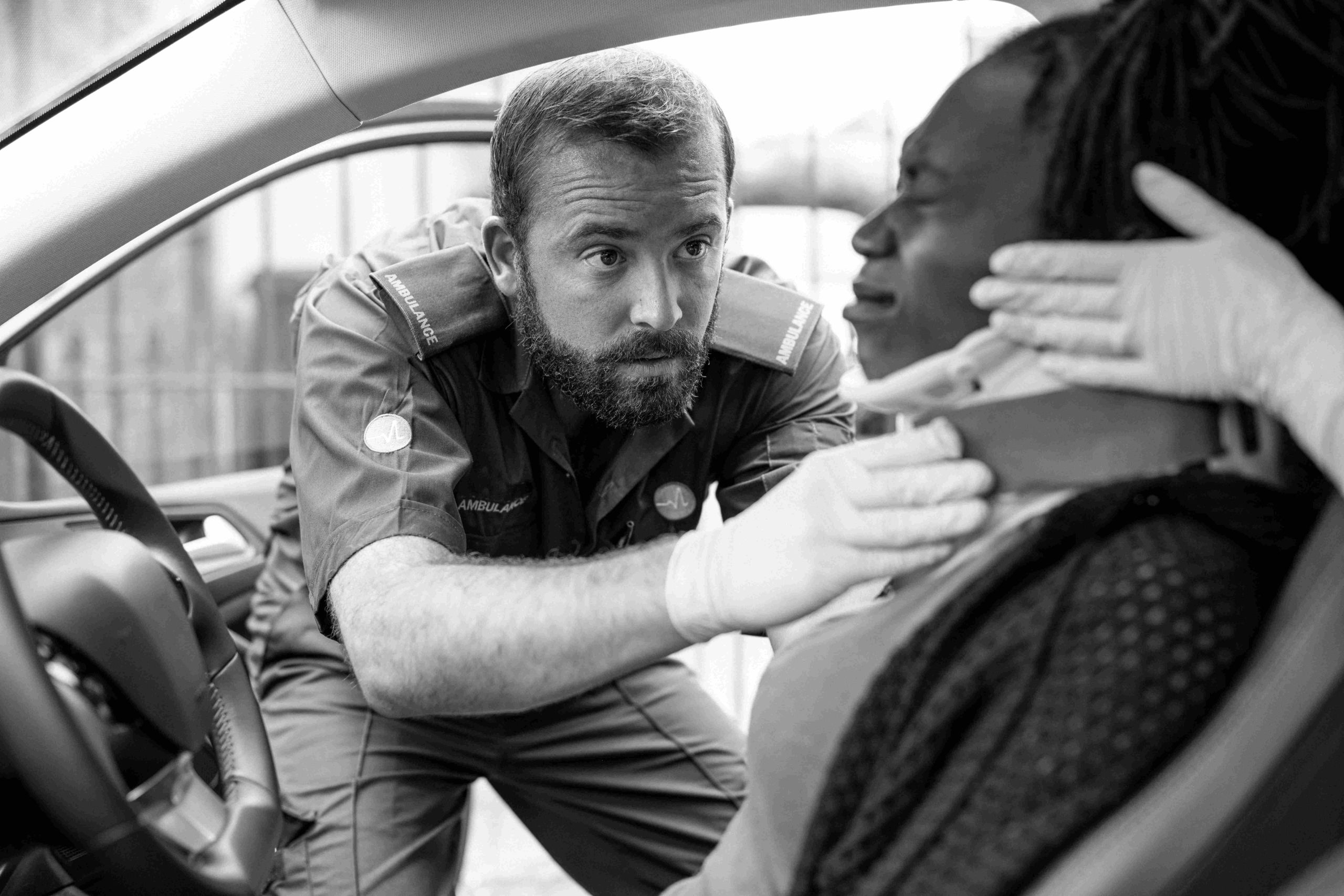 paramedic-placing-cervical-collar-injured-woman-from-car-accident-1 image Care team supporting a catastrophic injury patient during rehabilitation